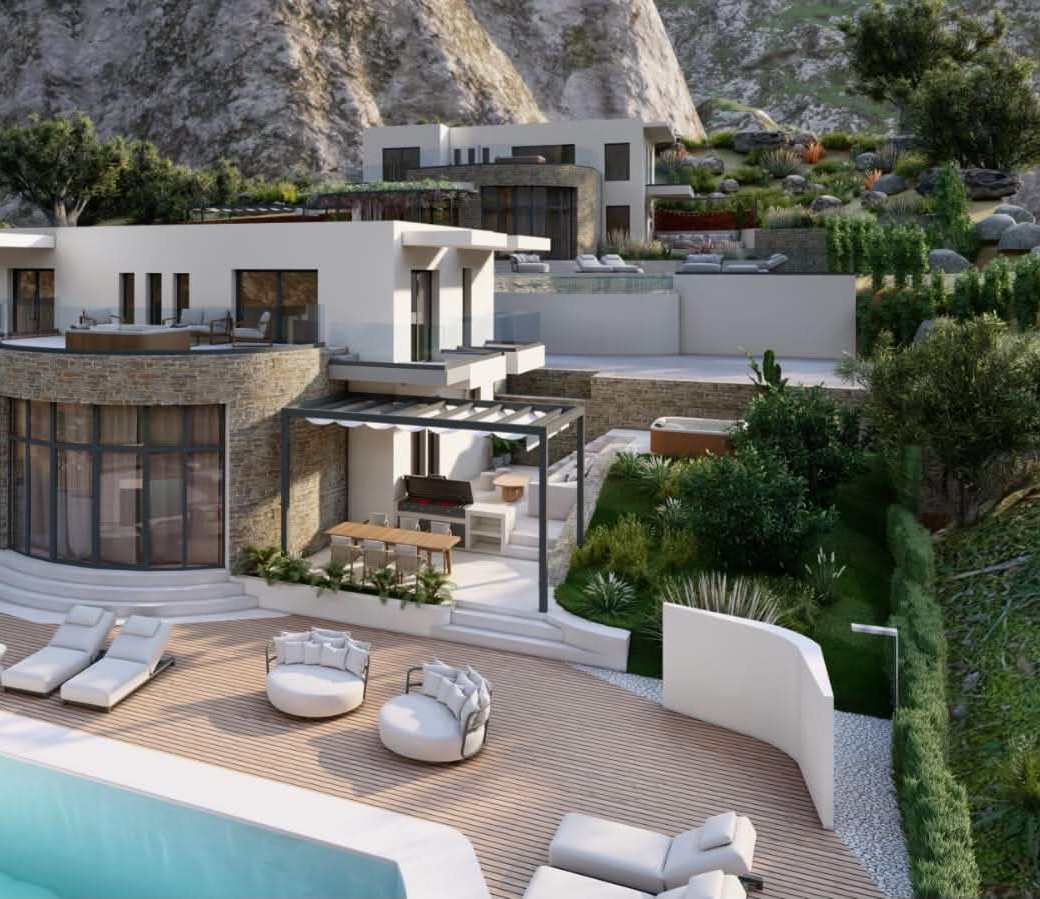 Στρογγυλά καθιστικά και ξαπλώστρες outdoor με κρεμ μαξιλάρια σε ξύλινο κατάστρωμα δίπλα σε πισίνα